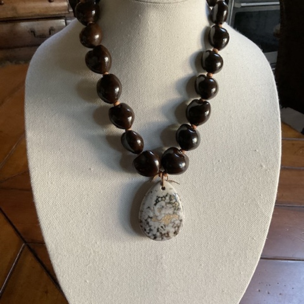 - Wooden bead necklace with multi colored stone